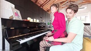 A hot woman makes love while her husband is playing the piano