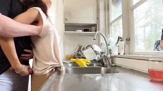 A couple has sex right in the kitchen, with intense passion