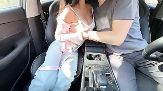 The girl is having fun with her teacher in the back seat of the car
