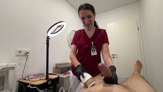 A hot nurse smooths out a client's intimate area with wax