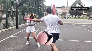 The pretty girl is having a hard workout with her personal trainer