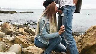 A hot blonde, Veronika Charm, is giving a skilled blowjob outdoors